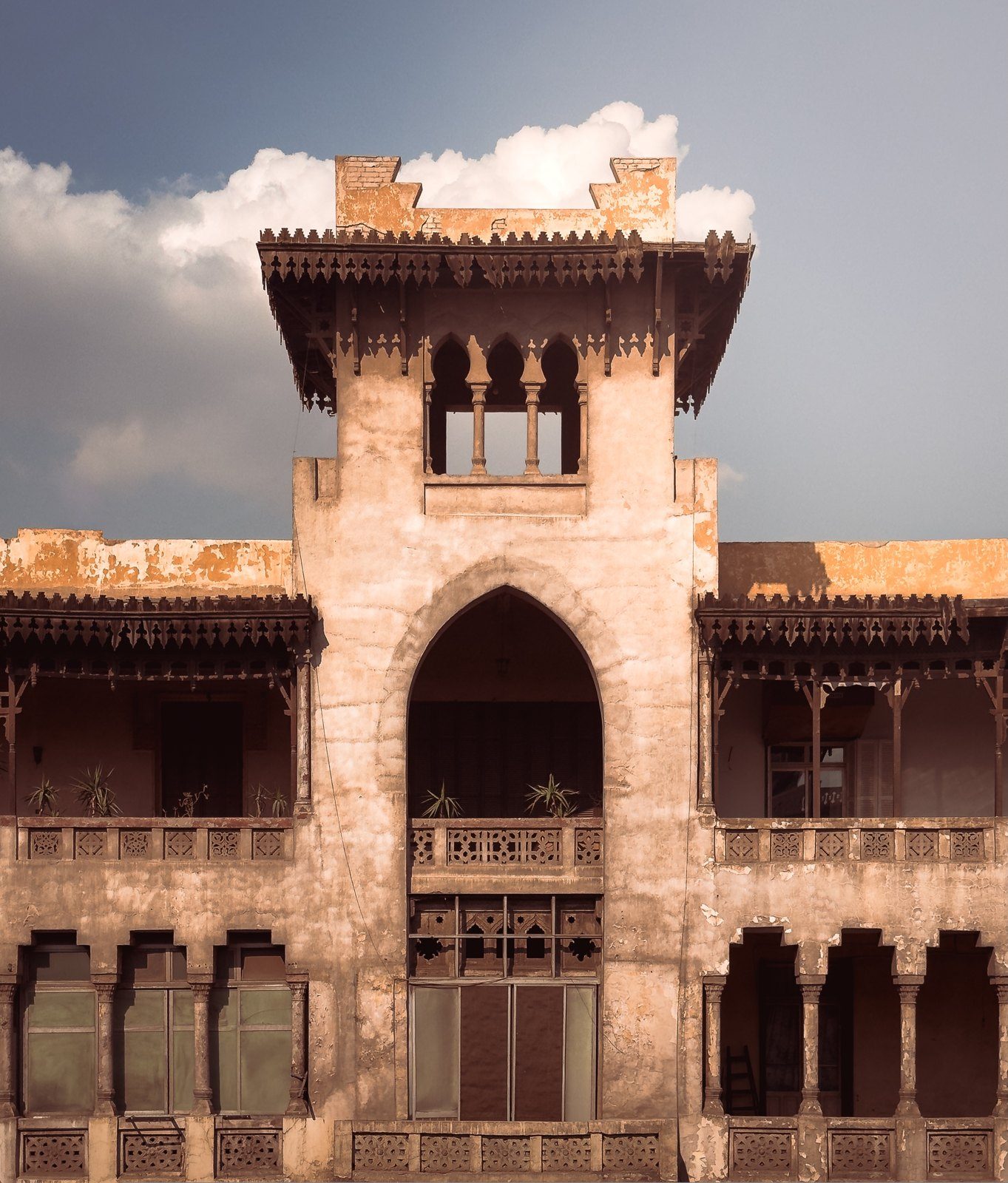 The tower and carved wooden balconies of the historic Heliopolis building